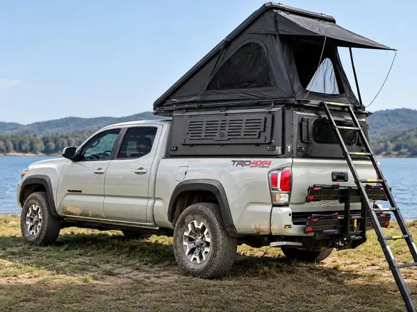 Integrated pop-up canopy with the tent open by a lake
